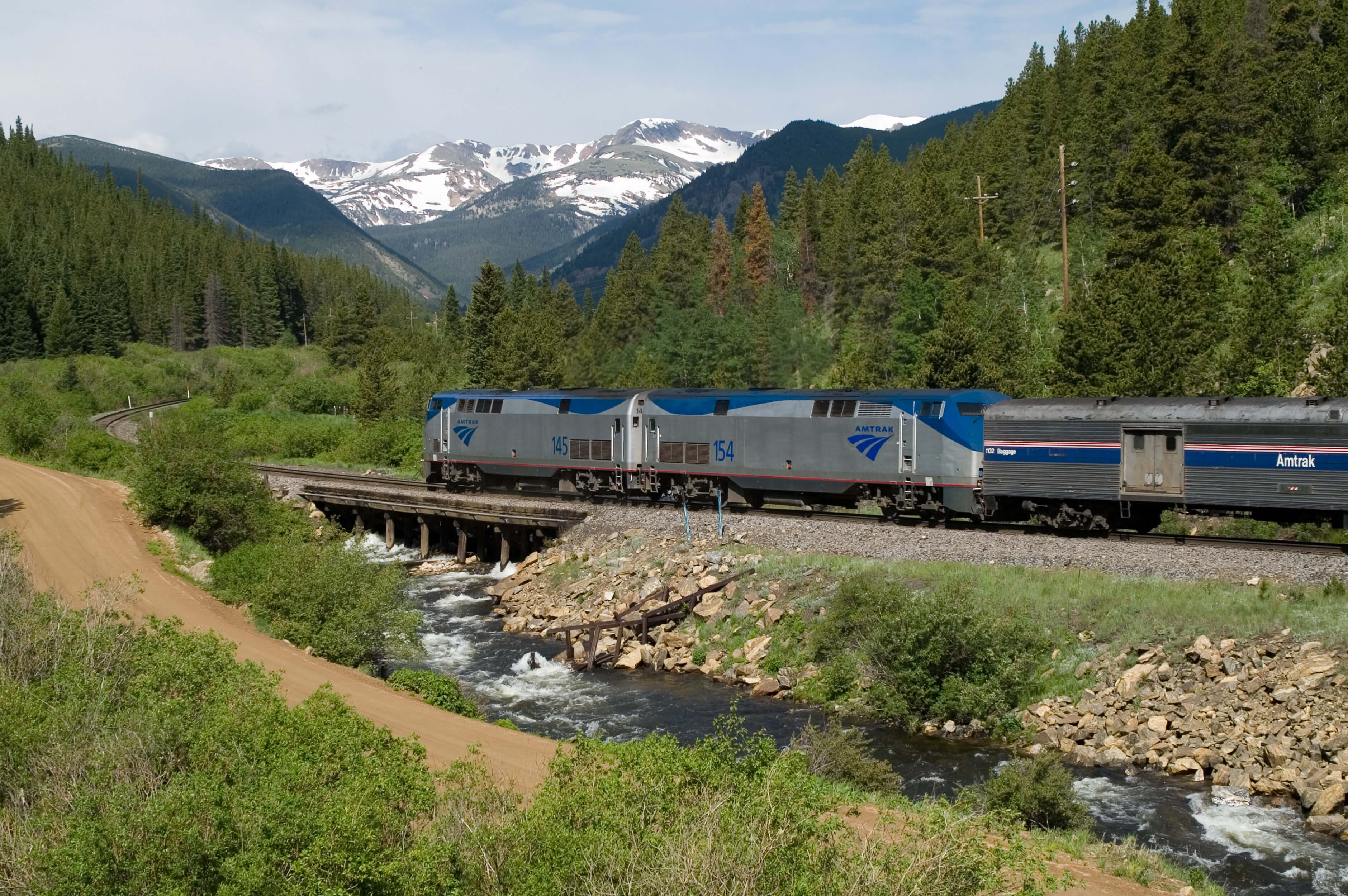 Amtrak's Empire Builder delivers you right at Glacier National Park's doorstep. Call Amtrak vacations today! Amtrak's Empire Builder coming straight into Glacier National Park