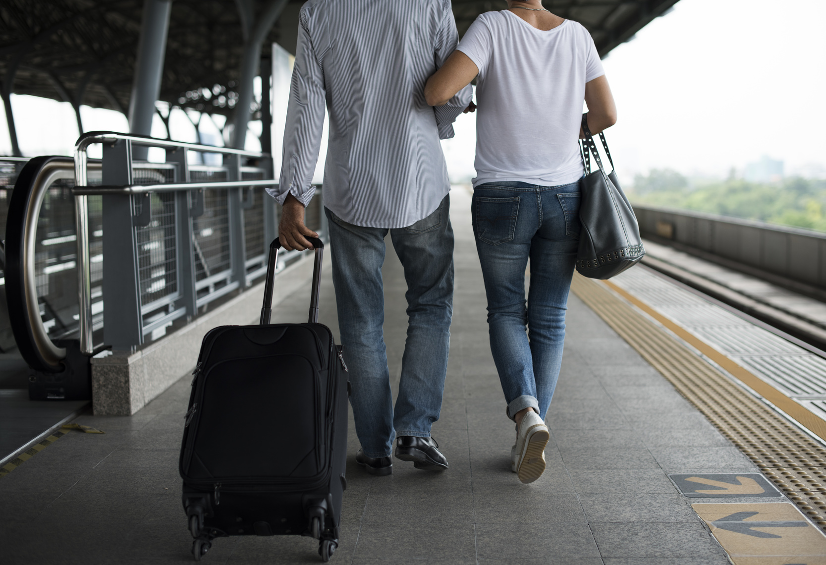 Senior couple traveling train station