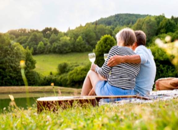 couple having a picnic and a glass of wine