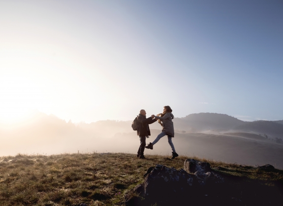 man and woman playing while exploring
