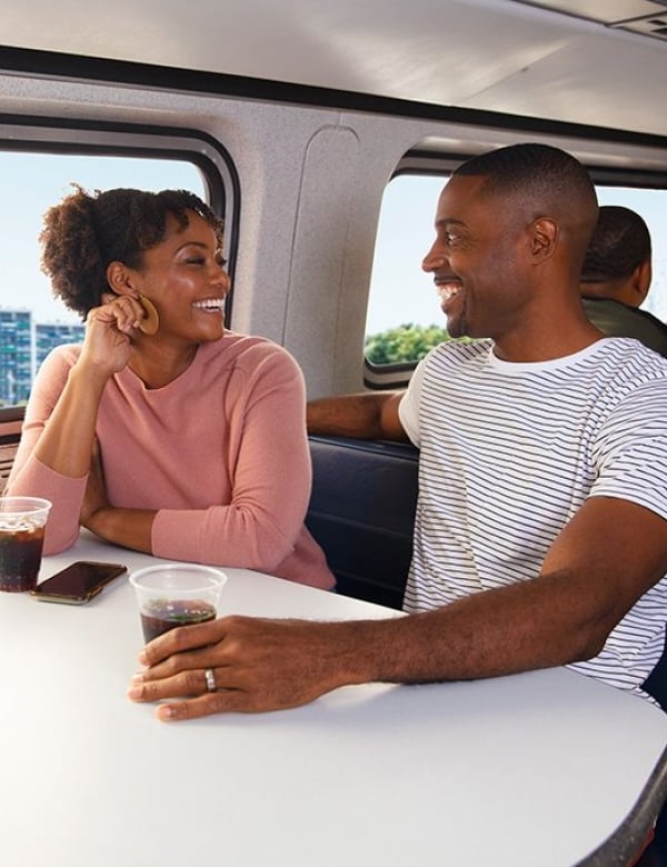 happy couple onboard amtrak
