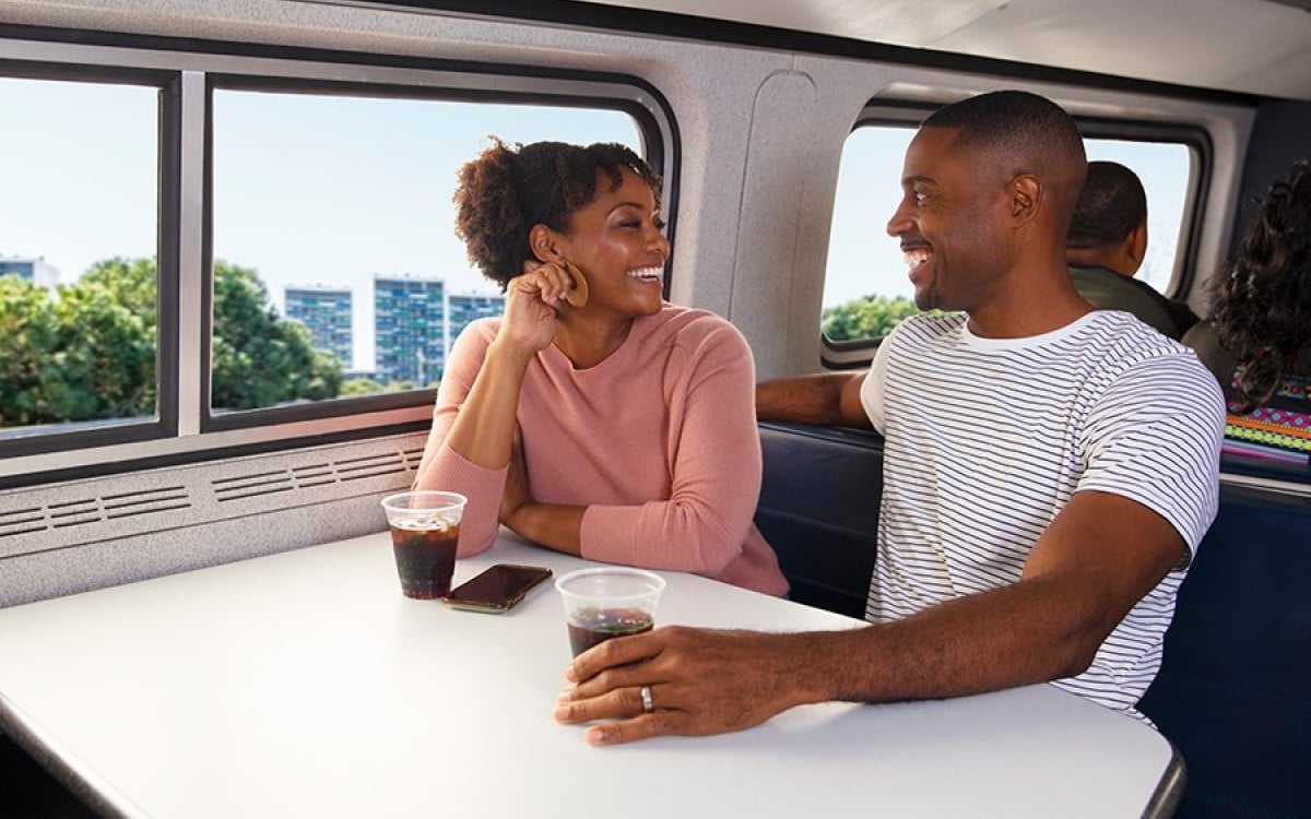 happy couple onboard amtrak