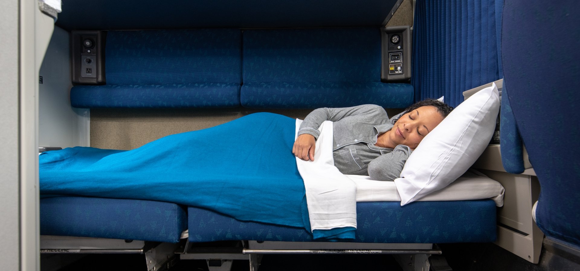 woman laying down in amtrak bedroom